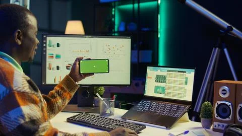 Expert analyst providing online evaluations of finances next to chroma key Stock Photos