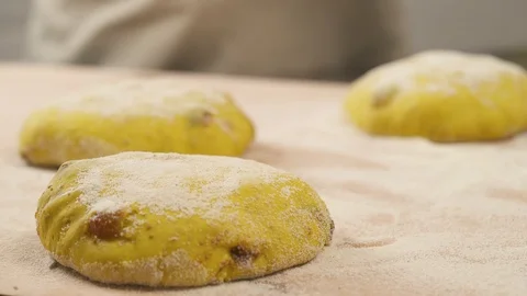 An expert baker performing bread scoring. Food preparation concept. Professional Stock Footage 106379780