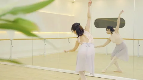 Expert ballerina ballet dancer training in studio perform elegant pose, dance Stock Footage 332391921