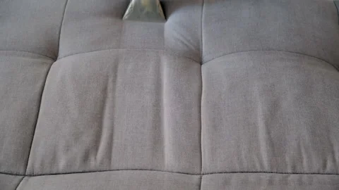 Expert cleaner hands using vacuum cleaner removing dirt stains from sofa. Stock Footage 311799134