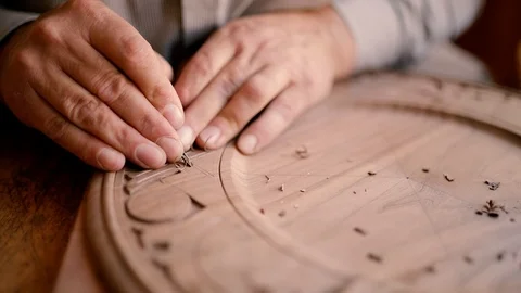 Expert craftsman work on his beautiful wood ornamental plate. Slowmotion closeup Stock Footage 124692127
