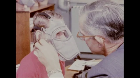 Expert do live tests on the masks to determine its quality - 1960 Video stock 94256239
