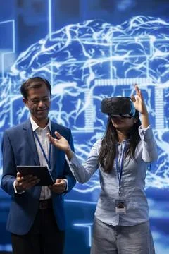Expert doing VR demonstration at AI tech summit event Stock Photos