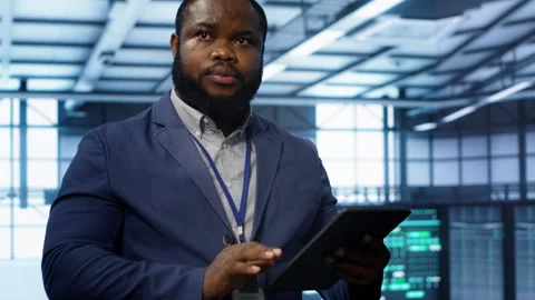 Expert ensuring optimal performance and data integrity in server hub Stock Footage 277658617