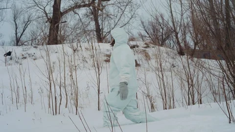 Expert evaluates frozen environments with caution and skill. Field specialist Stock Footage 346471921