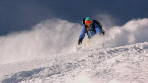 Expert female skis down deep powder snow, Alta, Utah. Stock Footage 99315613