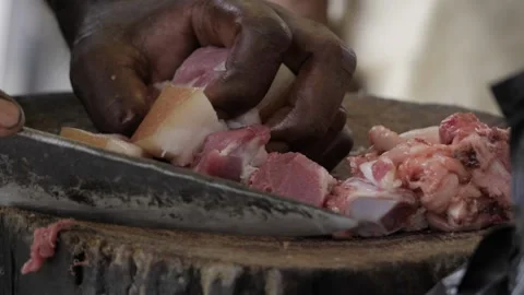 Expert Hand at Work  Efficient Meat Preparation Stock Footage 323998767