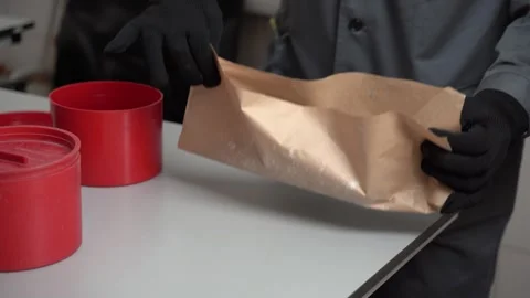 Expert Handling of a Wrapped Item in a Controlled Environment for Safety and Stock-Footage 300489329