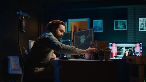 Expert inserts disk into PC containing software evolving AI into sentient being Stock Photos