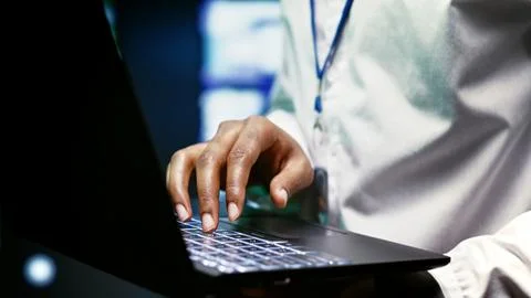 Expert installing server room firewalls Stock Photos
