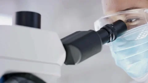 The expert Laboratory technicians use microscopes to analyze air samples. Stock Footage 336583670