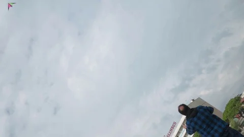 Expert Man Flying Kite in a windy day Stock Footage 117410322