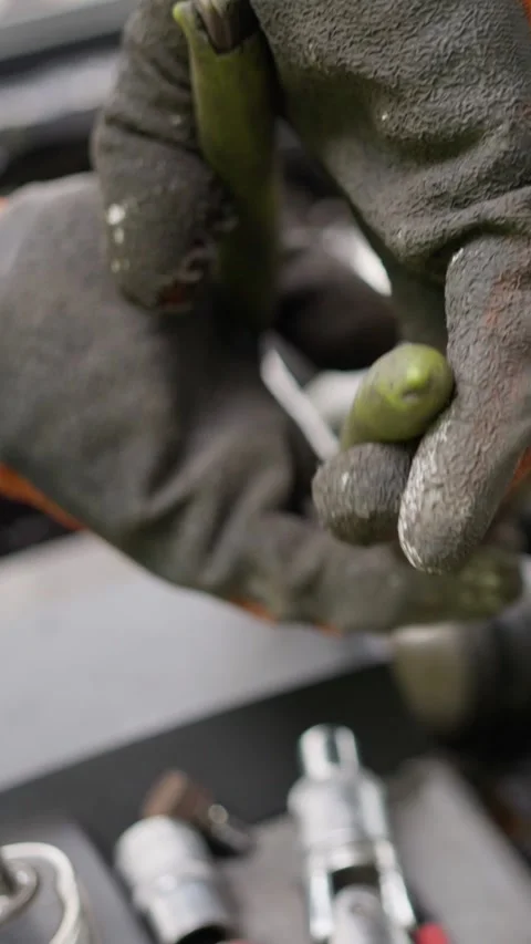 An Expert Mechanic Skillfully Repairing Engine Components with Ultimate Stock Footage 317566310