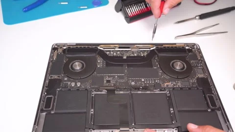 Expert notebook computer repair and maintenance in a professional workshop Stock Footage 309803972