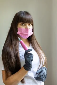 Expert performs lip permanent makeup procedure in a clean, professional setting Stock Photos