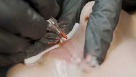 Expert in permanent cosmetology demonstrates precise application techniques Stock Footage 309192822