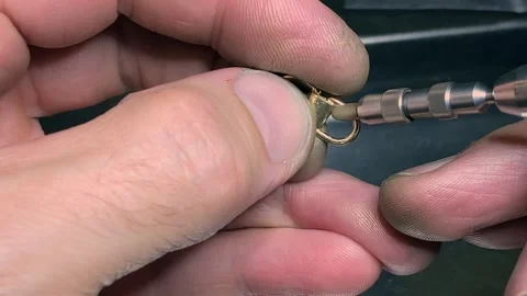 Expert ring restoration process showcased in jewelry workshop Stock Footage 319575594