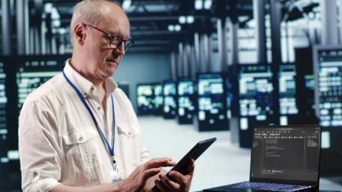 Expert running code in data center Stock Footage 247902653