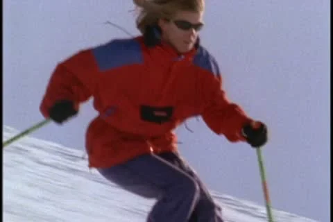 An expert skier navigates down a slope Stockbeeldmateriaal 10576010