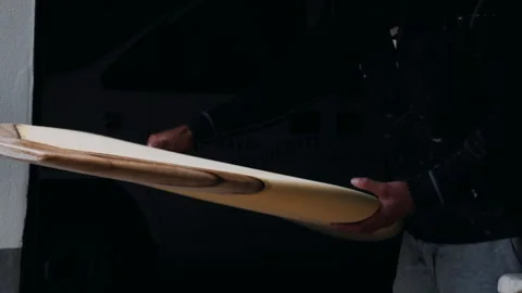 Expert surfboard shaping techniques demonstrated by skilled shaper in worksho Stock Footage 321568180