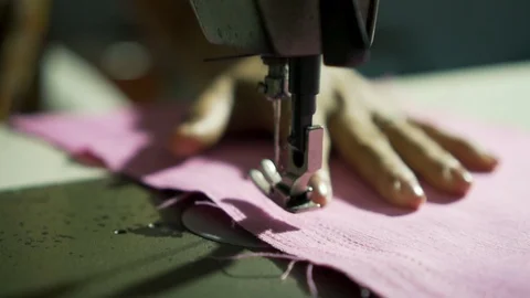 Expert tailor hands sewing at automatic sewing machine. Stock Footage 104020850