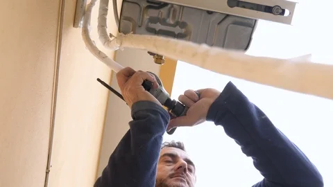 Expert technician repairs the air conditioner Stock-Footage 85594813