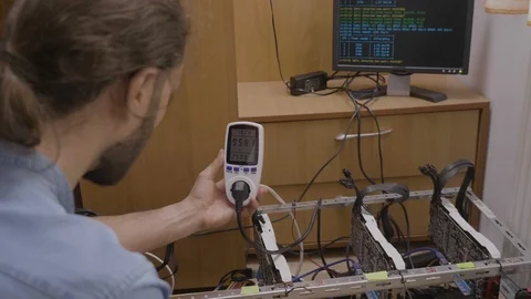 Expert technician using a power meter monitoring and indicating consumption a Stock Footage 102475102