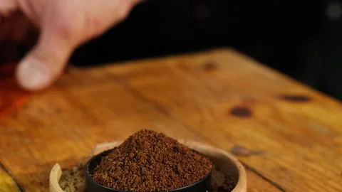 Expert uses special tool to level surface of ground coffee Stock Footage 268003442