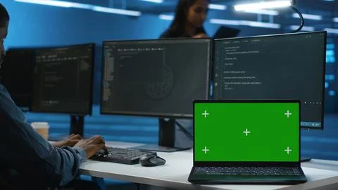Expert using chroma key computer to do servicing on data center rigs Stock Photos