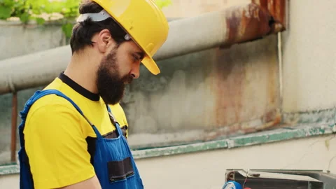 Expert using pressure measurement device | Stock Video | Pond5