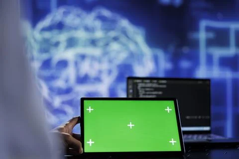 Expert writes AI code on mockup tablet Stockfoto's