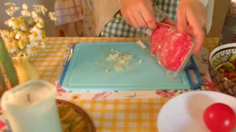 Expertly Preparing Ground Meat on a Clean Cutting Board for Cooking Stock Footage 318923335