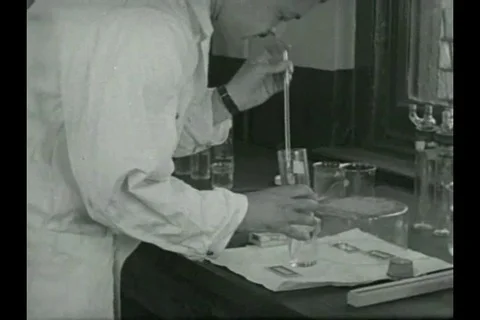 Experts study and examine the dust for distribution - 1936 Stock Footage 93113218
