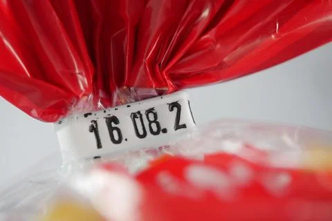 Expire date marked on bread red plastic packaging Stock Photos