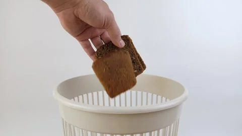 Expired bread is thrown into the trash. Processing of food waste. Stock Footage 274055321