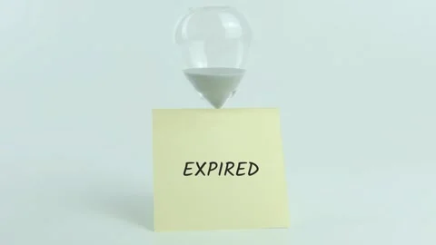Expired written on yellow sticky note placed on hourglass on white Stock Footage 313480988