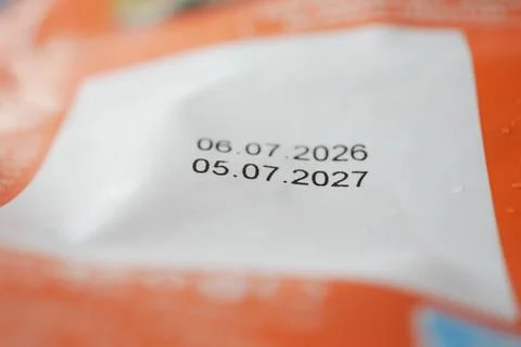 Expiry dates printed on packaging in a close-up view Stock Photos