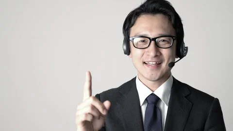 Explaining asian operator. Stock Footage 101365026