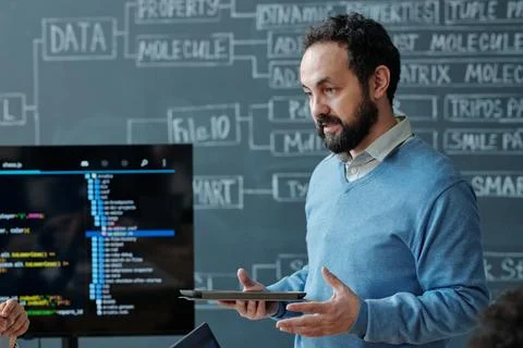 Explaining Coding Concepts During Classroom Session Stock Photos