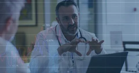 Explaining physician in white coat with stethoscope reviewing results in clinic Stock Photos
