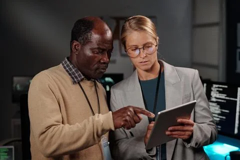 Explaining young colleague online data Stock Photos