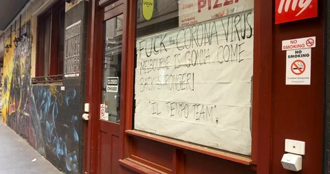 Explicit Coronavirus Sign on Closed Cafe During COVID Shutdown Video stock 129349582