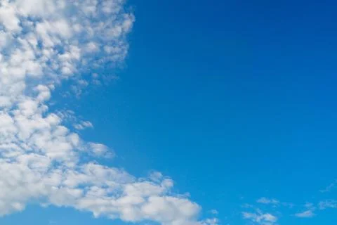 Explode white cotton fluffy clouds in blue sky for journey and meteorology and w Stock Photos