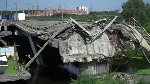 Exploded bridge in Irpin, Kyiv region after russian invaders attack. Cars drive Stockbeeldmateriaal 221256874