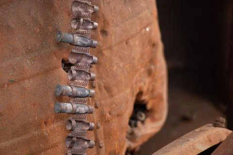 Exploded bullets in a cartridge belt inside an exploded Russian tank in Ukrai Stock Photos