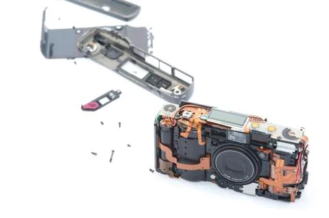 Exploded camera laying on white background Stock Photos