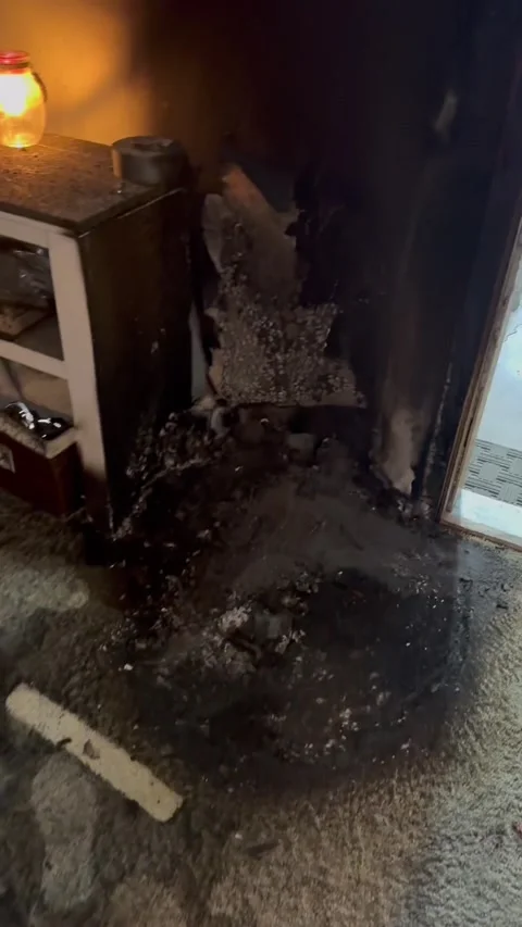Exploded Lithium Battery Leaves House Covered in Ash, usa - 23 Apr 2025 Video stock 308971523
