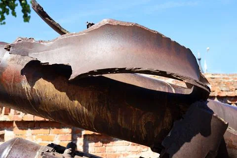 The exploded muzzle of a combat military cannon Stock Photos