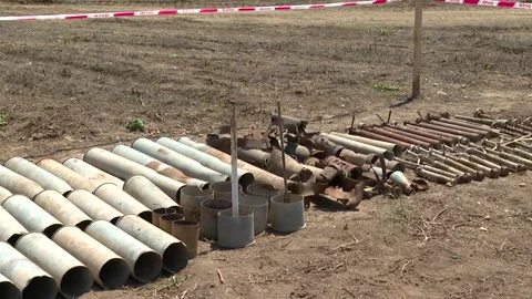 Exploded shell casings iron scraps collected from the battlefield area Video stock 295436769