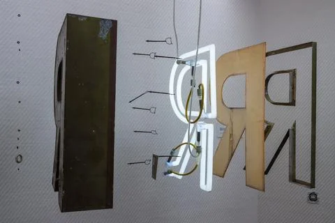 Exploded view neon sign letter. Stock Photos